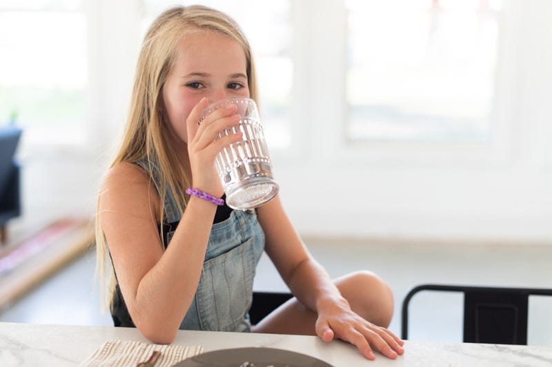 Girl drinking clean water.