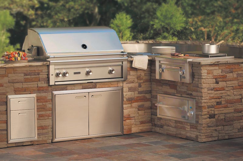 Outdoor kitchen with a built in BBQ and stove