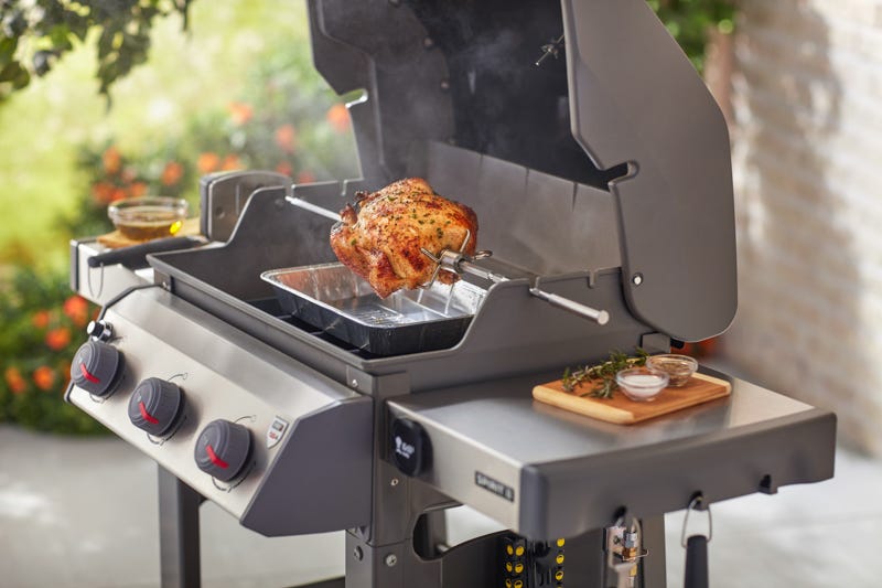 BBQ from Trail Appliances with a chicken on a Rotisserie